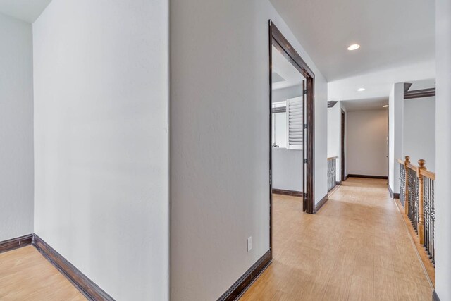 hallway featuring light hardwood / wood-style flooring