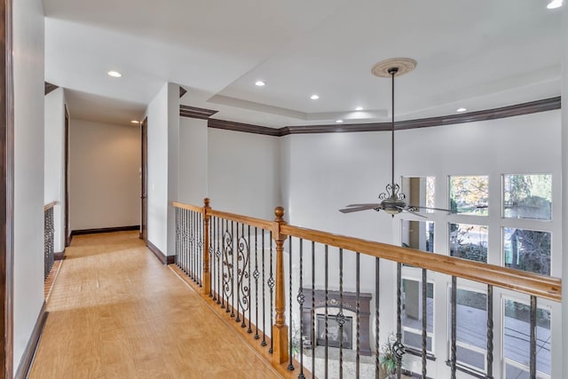 hall featuring crown molding and light wood-type flooring