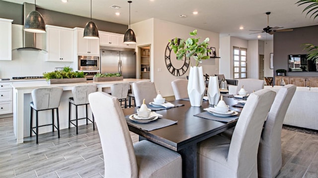 dining space with ceiling fan