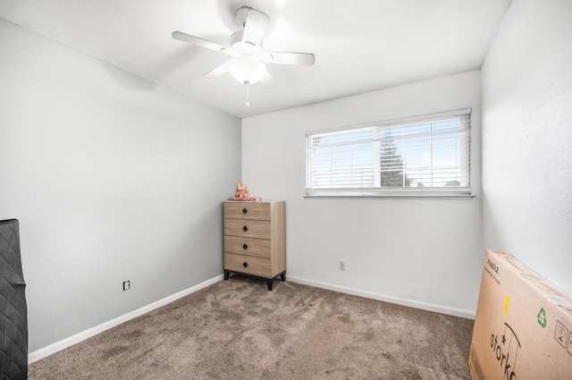 unfurnished bedroom featuring ceiling fan and carpet floors