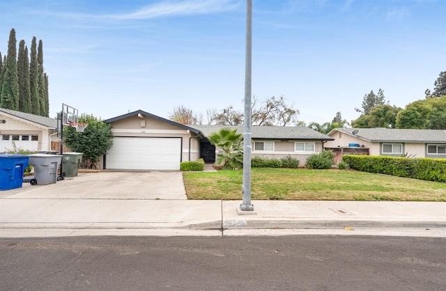 ranch-style home with a front yard and a garage