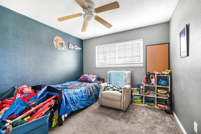 bedroom with ceiling fan and carpet