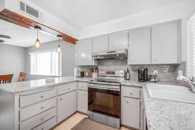 kitchen with kitchen peninsula, sink, stainless steel electric range oven, hanging light fixtures, and light tile patterned flooring