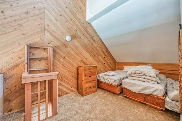 bedroom with wooden walls, carpet floors, and lofted ceiling