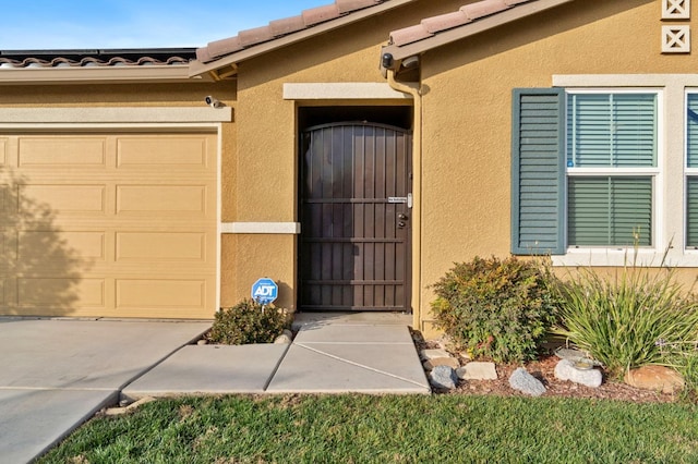 entrance to property featuring a garage