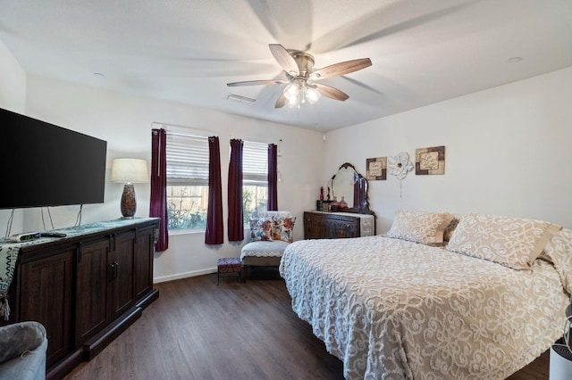 bedroom with ceiling fan and dark hardwood / wood-style floors