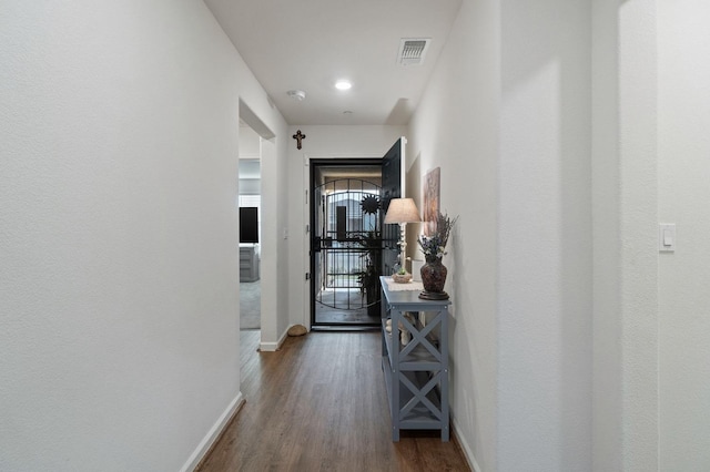 hallway featuring hardwood / wood-style flooring