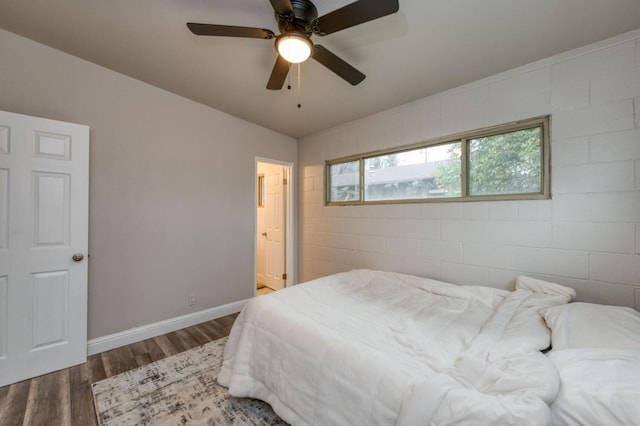 bedroom featuring ceiling fan and dark hardwood / wood-style flooring