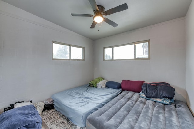 bedroom featuring vaulted ceiling and ceiling fan