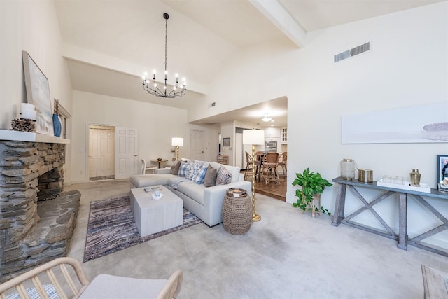 carpeted living room featuring beamed ceiling, high vaulted ceiling, a notable chandelier, and a stone fireplace