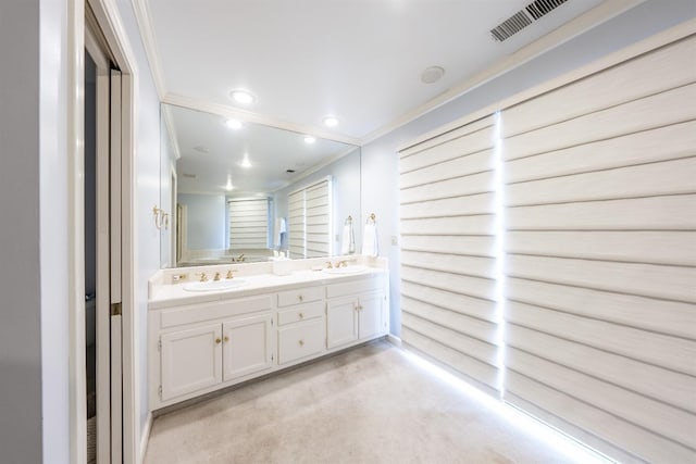 bathroom with vanity and crown molding