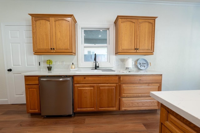 kitchen with stainless steel dishwasher, light stone countertops, sink, and dark hardwood / wood-style flooring