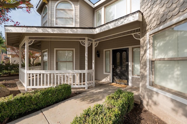 property entrance with covered porch