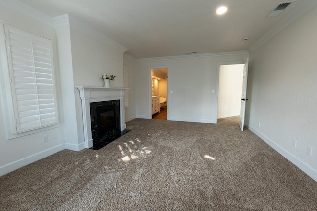 unfurnished living room featuring dark colored carpet, crown molding, and a premium fireplace