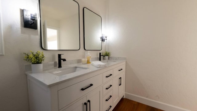 bathroom featuring vanity and hardwood / wood-style floors