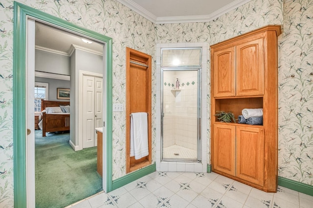 bathroom with crown molding, vanity, and a shower with shower door