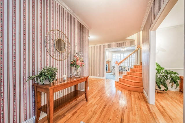 corridor featuring hardwood / wood-style floors and crown molding