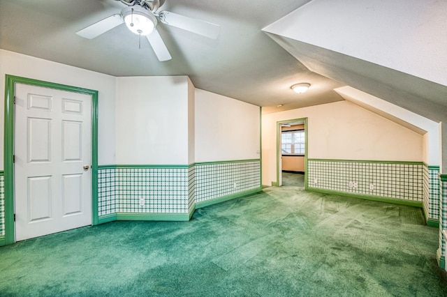 bonus room featuring ceiling fan, light colored carpet, and lofted ceiling