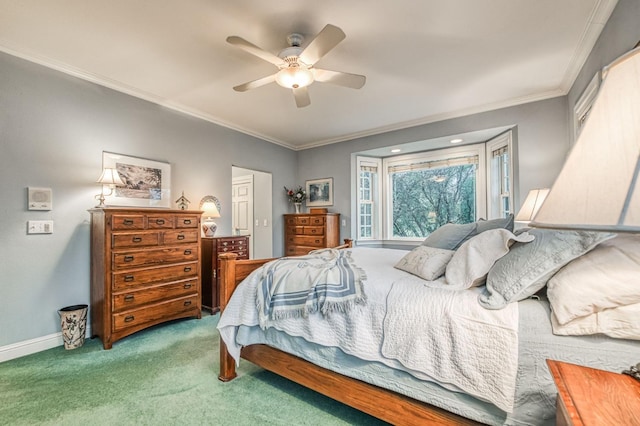 carpeted bedroom with ceiling fan and ornamental molding