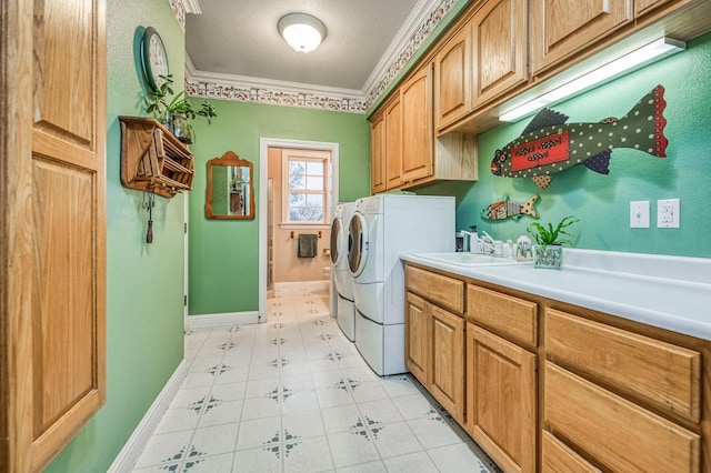 clothes washing area with sink, cabinets, separate washer and dryer, crown molding, and a textured ceiling