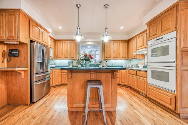 kitchen with stainless steel refrigerator with ice dispenser, ornamental molding, white double oven, light hardwood / wood-style flooring, and a kitchen island