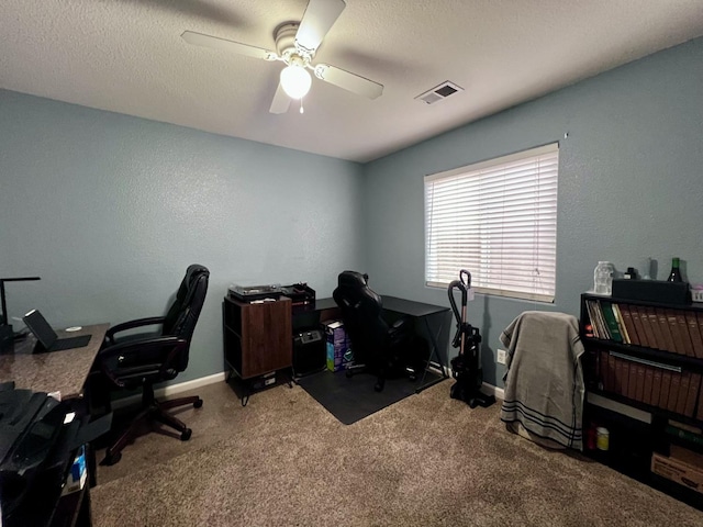 office featuring ceiling fan, carpet floors, and a textured ceiling