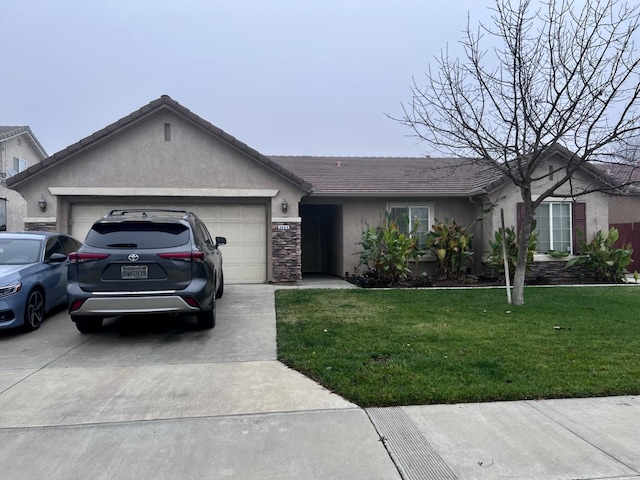 ranch-style home with a front yard and a garage