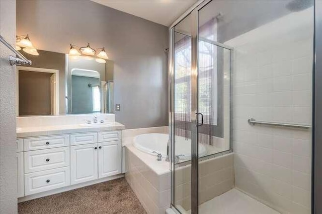 bathroom featuring vanity and separate shower and tub