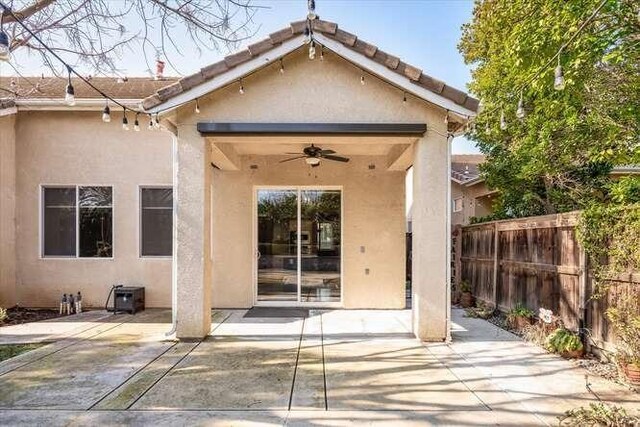 back of house featuring a patio and ceiling fan