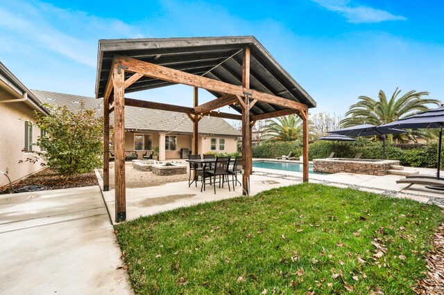 view of yard with a gazebo, a patio area, and an outdoor fire pit