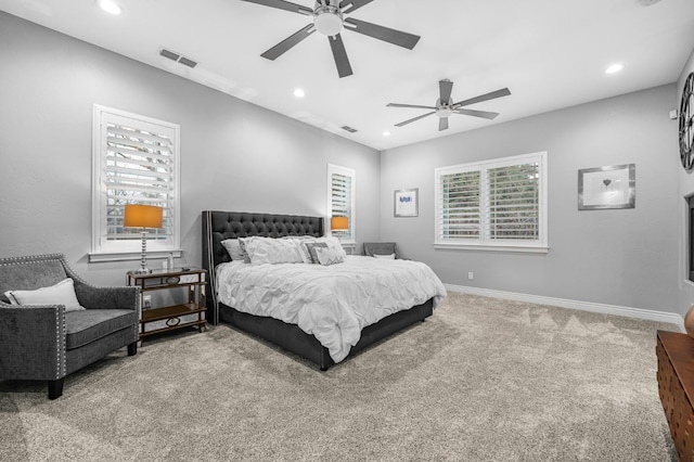 carpeted bedroom featuring ceiling fan