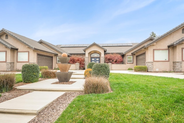 ranch-style house with a garage and a front lawn