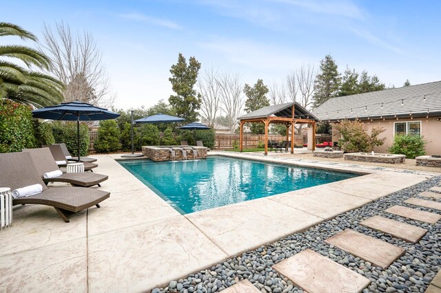 view of pool featuring a gazebo and a patio area