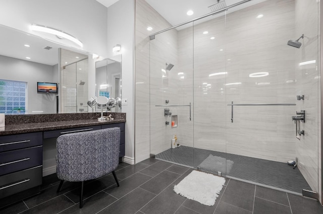 bathroom featuring vanity and a shower with shower door