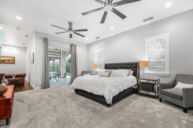 carpeted bedroom featuring ceiling fan and access to outside