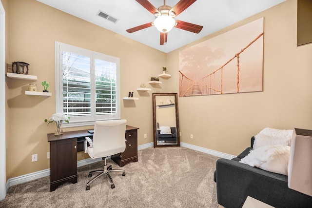 carpeted home office with ceiling fan