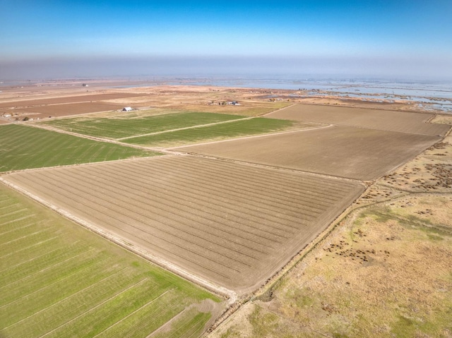 drone / aerial view with a water view and a rural view