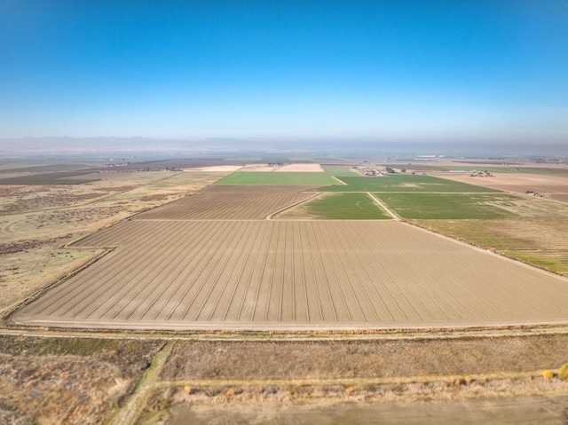 birds eye view of property with a rural view