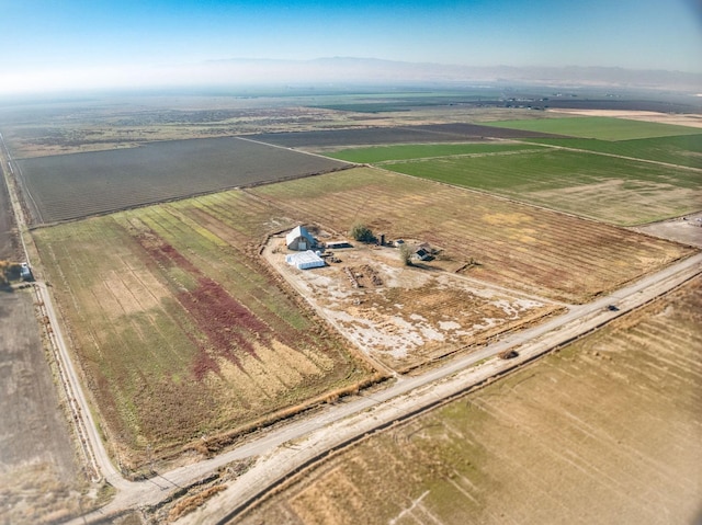 birds eye view of property with a rural view