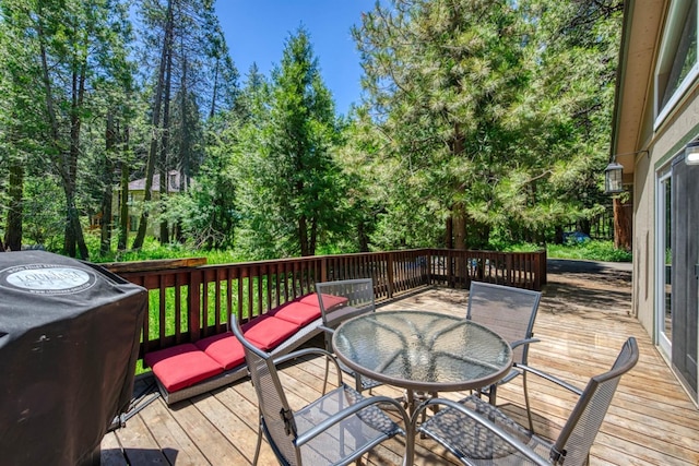 wooden terrace featuring area for grilling