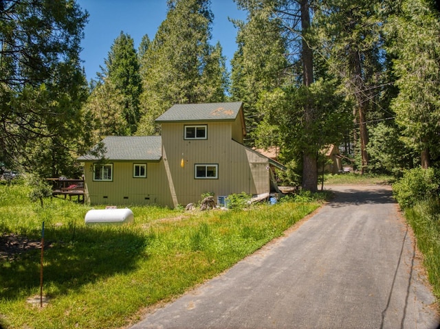 view of property exterior featuring a wooden deck