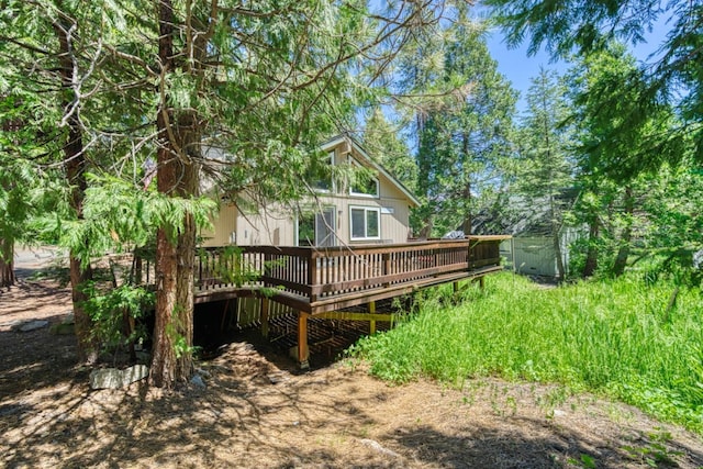 back of property with a wooden deck