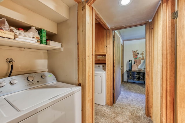 laundry area with light carpet, washer / clothes dryer, and cabinets