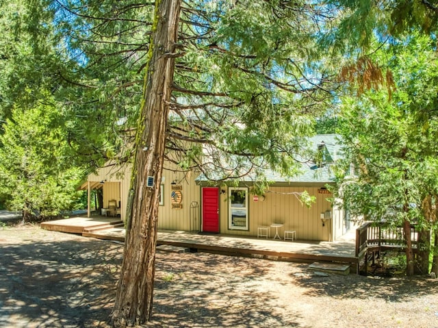 view of front of property featuring a wooden deck