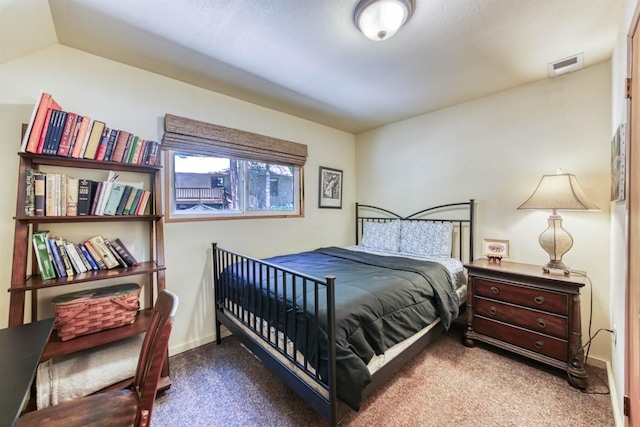 bedroom with carpet and vaulted ceiling