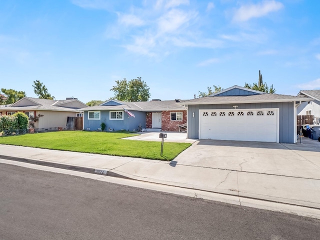 ranch-style house with a garage and a front lawn