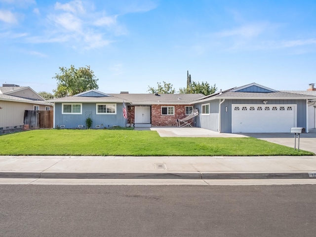 ranch-style house featuring a front lawn and a garage