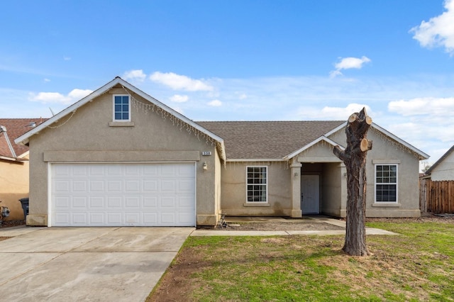 ranch-style house with a garage and a front lawn