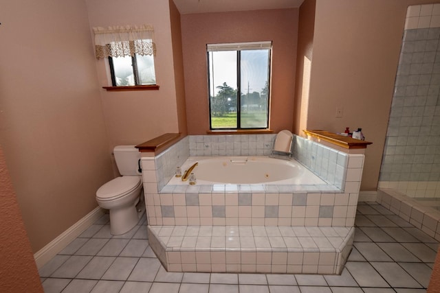 bathroom featuring tile patterned flooring, shower with separate bathtub, and toilet