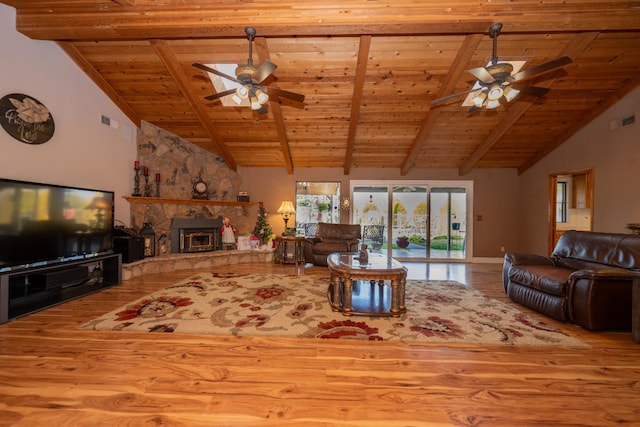 8510 E Nees Ave, Clovis, CA 93619 - living area featuring ceiling fan, wood finished floors, wood ceiling with exposed beams, high vaulted ceiling, and a fireplace